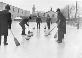 people of old time playing curling